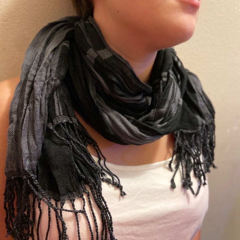 Black and grey scarf with fringe at the bottom